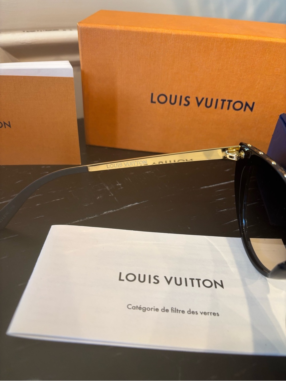 Louis Vuitton brown cat-eye sunglasses with gold stud accents. - Picture 10 of 12